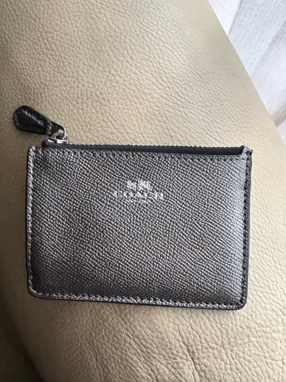 Coach women’s metallic key card holder.